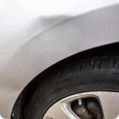 Example of paintless dent repair, before
