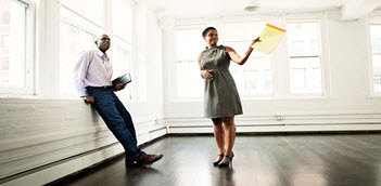 Realtor and tenant looking at an apartment.