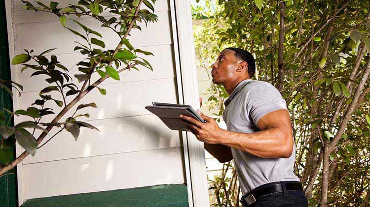 Man inspecting a home
