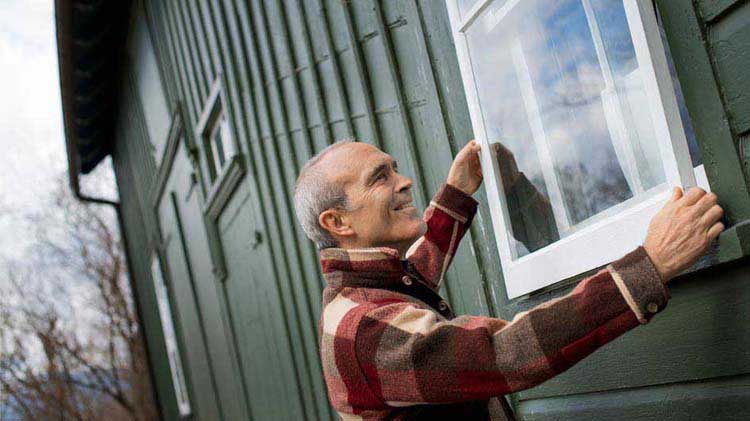 Man fixing window