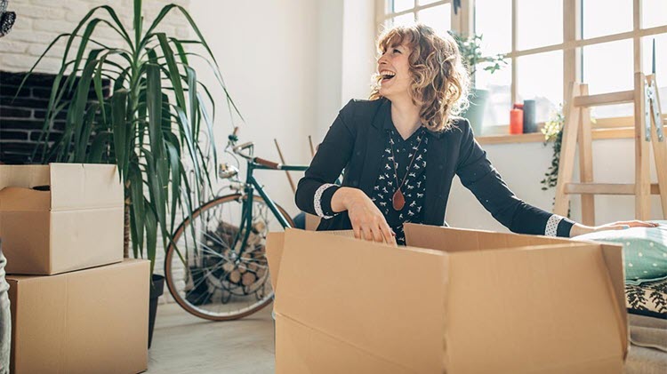 Woman unpacking in a new home