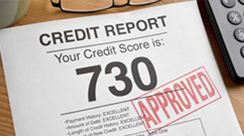 Photo of a credit score report with approved stamped on the front