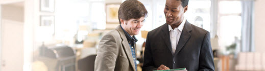 Two men discussing over a cell phone