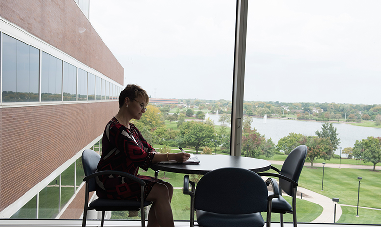 Women sitting at table with scenic views