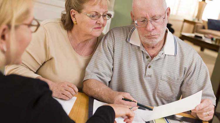 Older couple looking over paperwork