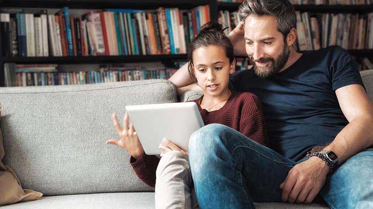 Father and teenager reviewing retirement information
